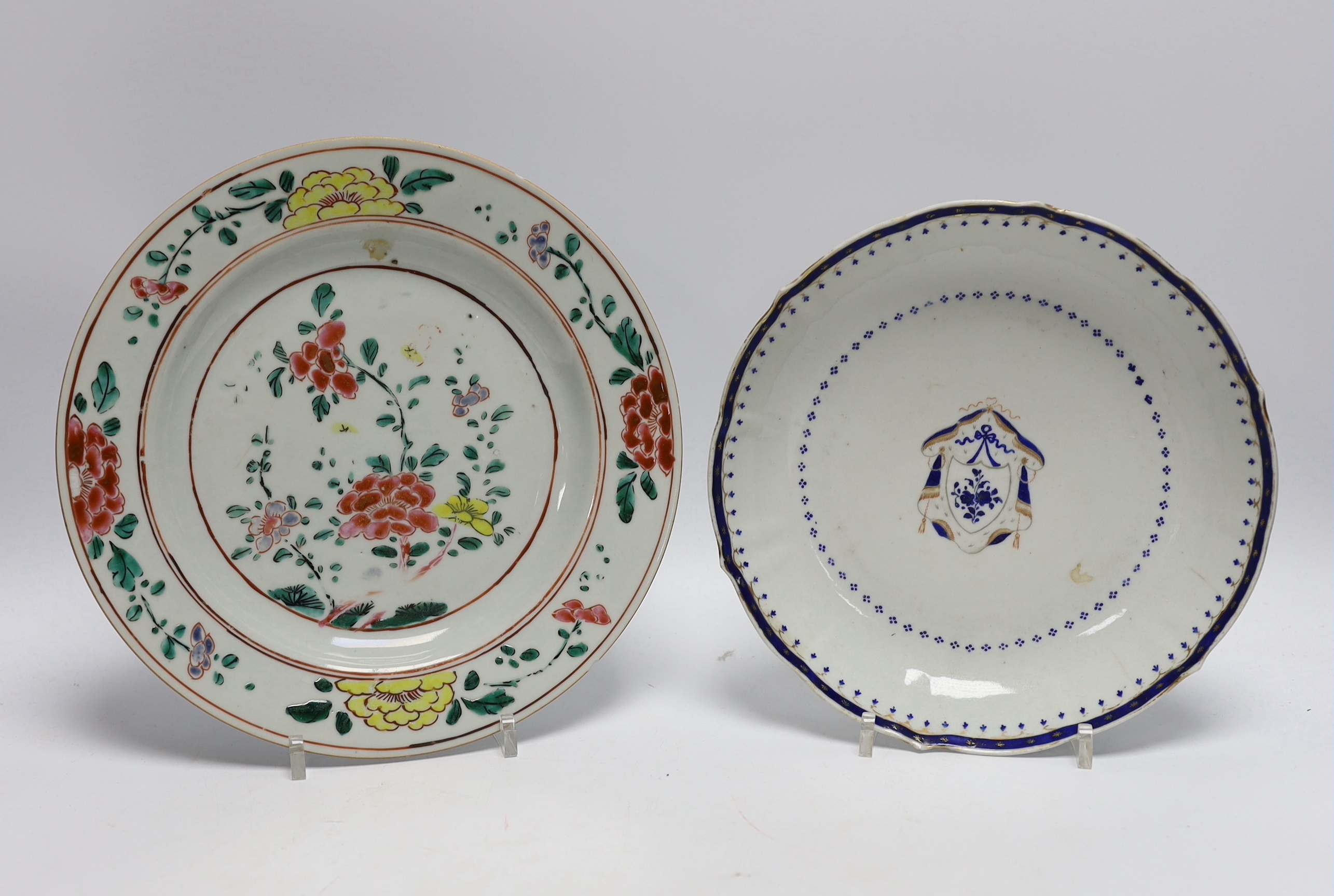 A Chinese famille rose plate together with two armorial or crested dishes, 23cm diameter